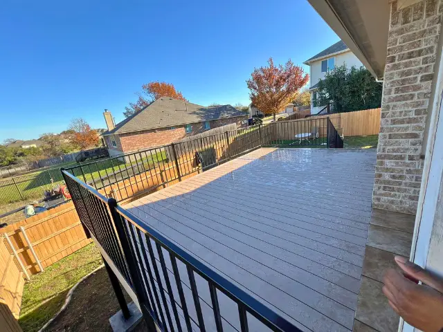Simple patio deck in a residential backyard